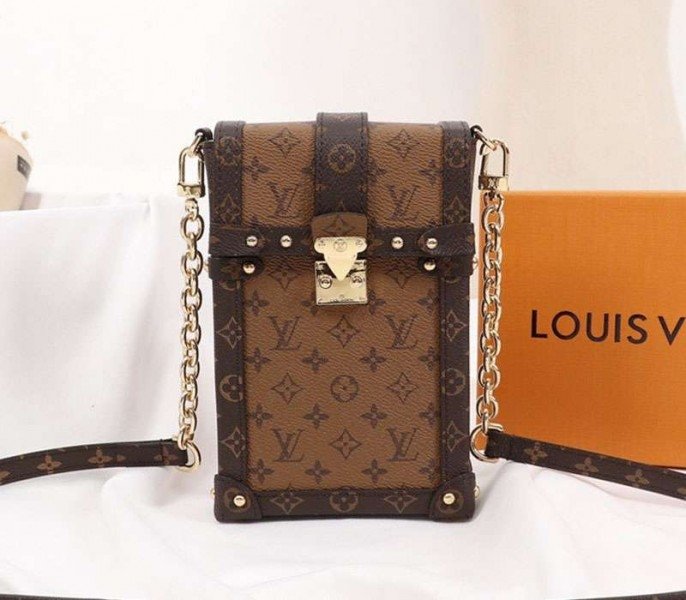 1A3C883A-1AB9-464C-2C68-A39685B8F6BA.jpg Louis Vuitton Monogram Reverse Canvas Vertical Trunk Pochette - Image 1