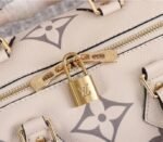 Louis Vuitton Bicolor Monogram Empreinte Leather Speedy Bandouliere 25 Handbag In Cream And Bois De Rose Pink - Image 8