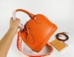 Louis Vuitton Epi Leather Alma BB Handbag In Orange With Jacquard Strap - Image 8