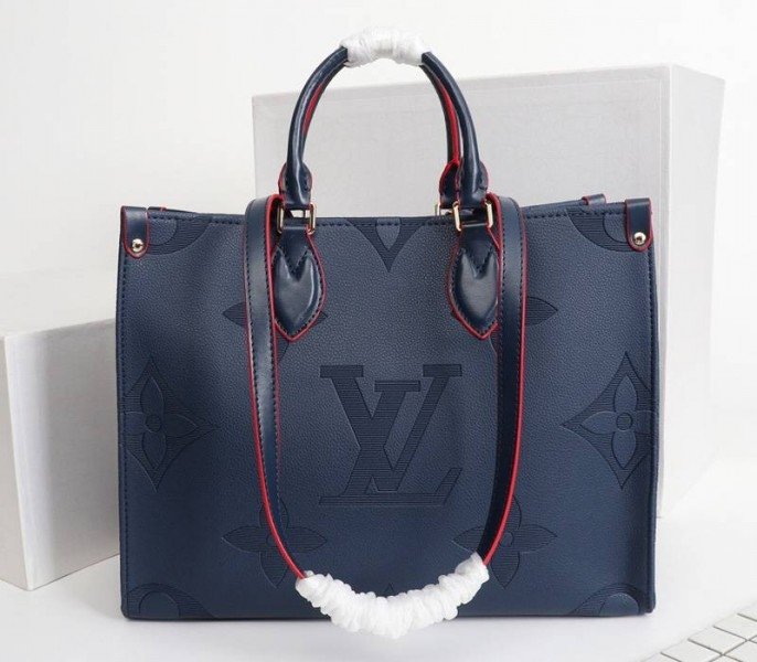 22B6C875-AD28-0F97-8E75-3977566A8569.jpg Louis Vuitton Monogram Empreinte Giant Onthego MM Tote In Navy Blue - Image 1