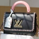 Louis Vuitton Epi Leather Twist MM Bag In Black With Braided Edges Flap