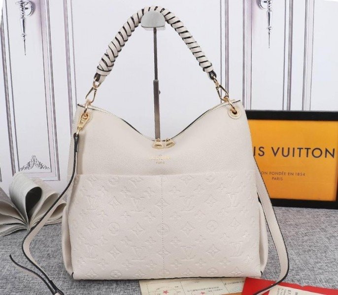 30B190A8-1062-2BFD-757B-6F4718AFA1C7.jpg Louis Vuitton Monogram Empreinte Leather Maida Hobo In Cream - Image 1