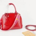 Louis Vuitton Epi Leather Alma BB Handbag In Red With Jacquard Strap