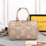 Louis Vuitton Bicolor Monogram Empreinte Leather Speedy Bandouliere 25 Handbag In Tourterelle Gray And Cream
