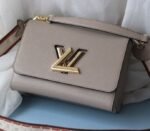 Louis Vuitton Epi Leather Twist MM Handbag In Galet Gray With Embroidered Strap - Image 2