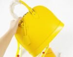 Louis Vuitton Epi Leather Alma PM Handbag In Cedrat Yellow With Jacquard Strap - Image 7