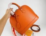 Louis Vuitton Epi Leather Alma PM Handbag In Orange With Jacquard Strap - Image 8