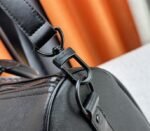 Louis Vuitton Taiga Leather Keepall Bandouliere 45 In Black And Monogram Macassar Canvas - Image 9