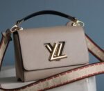 Louis Vuitton Epi Leather Twist MM Handbag In Galet Gray With Embroidered Strap