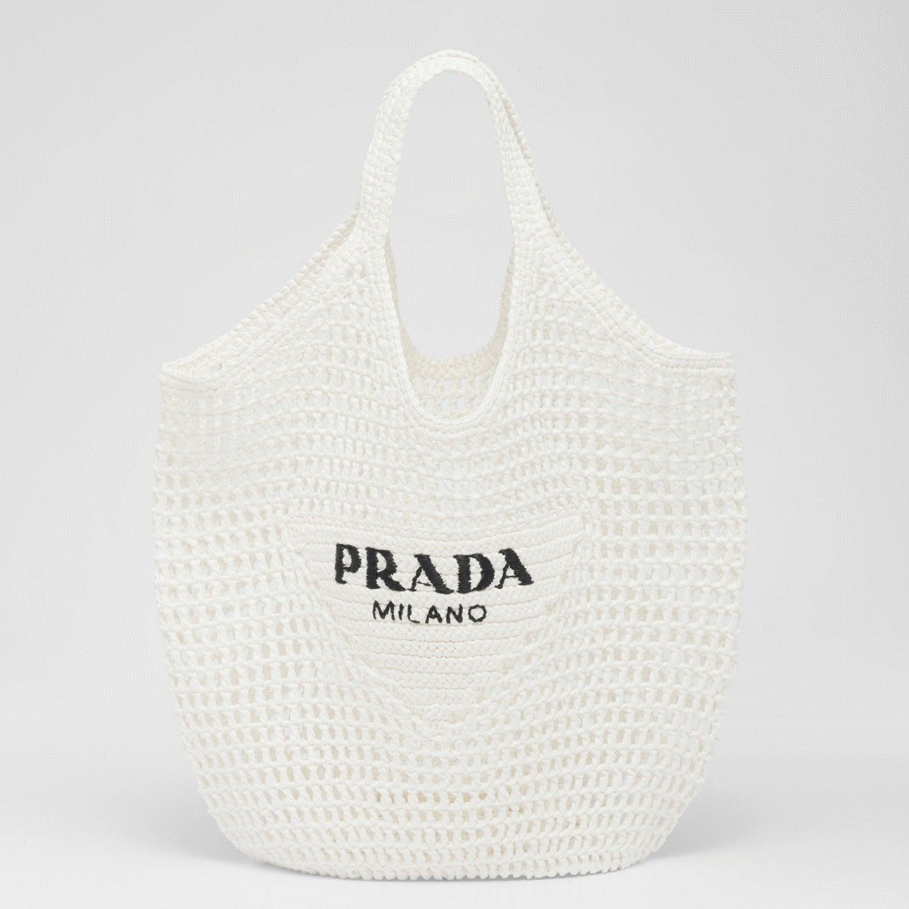 7ACBDBCD-F072-C8E9-A1CE-00ED7EF134AD.jpg Prada Large Tote Bag Replica in White Woven Raffia - Image 1