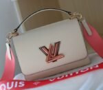 Louis Vuitton Epi Leather Twist MM Handbag In Quartz White With Gradient Strap - Image 2
