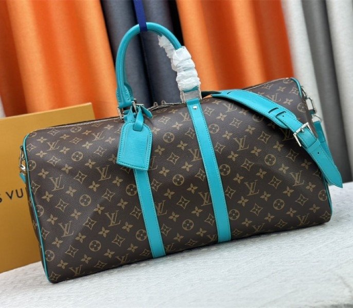 8B4CC94A-BA80-319A-ADF7-79A5B124FAF6.jpg Louis Vuitton Monogram Macassar Canvas Keepall Bandouliere 50 In Turquoise Blue - Image 1