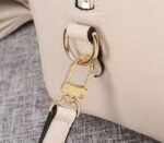 Louis Vuitton Bicolor Monogram Empreinte Leather Speedy Bandouliere 25 Handbag In Cream And Bois De Rose Pink - Image 9