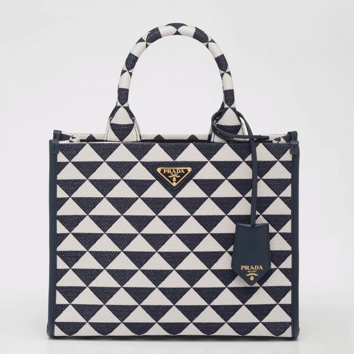 97B09F7A-3269-D281-B98A-28E73831DF55.jpg Prada Symbole Small Bag Knockoff in White/Blue Jacquard Fabric - Image 1