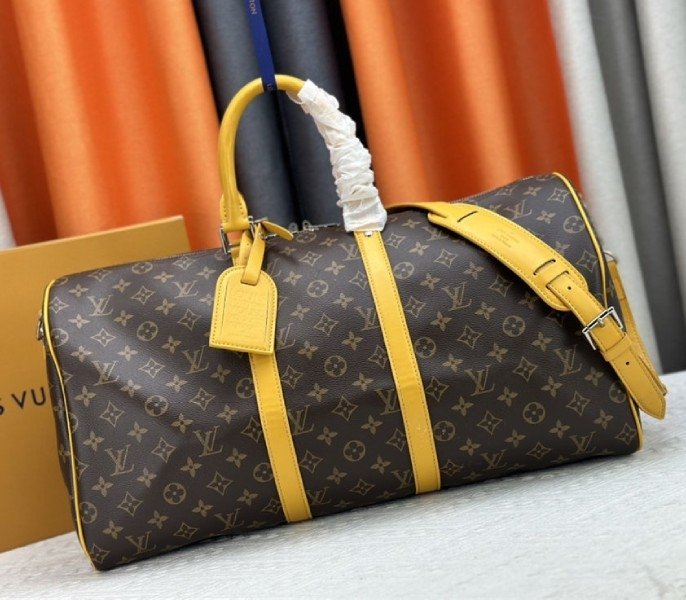 9C2EAED9-4F73-B36D-2ED8-6995C4119A2A.jpg Louis Vuitton Monogram Macassar Canvas Keepall Bandouliere 50 In Safran Yellow - Image 1