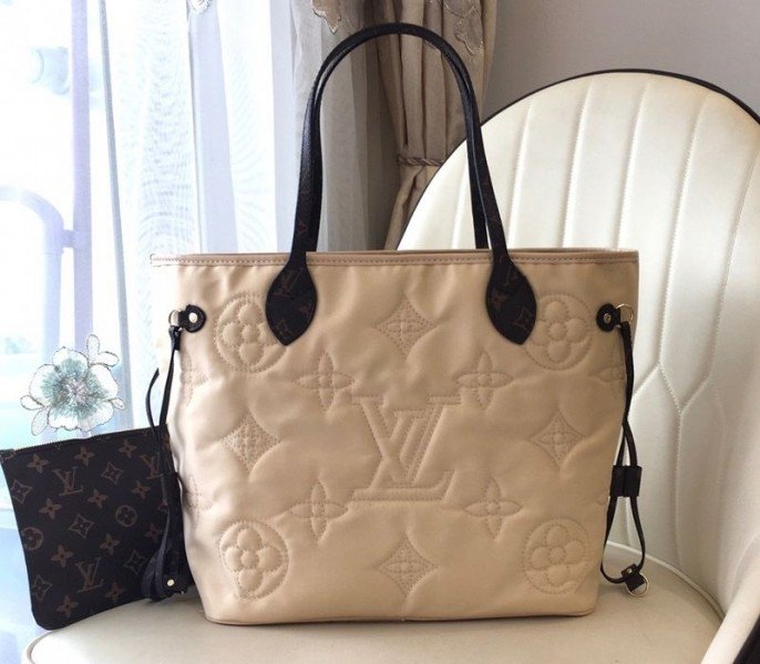 A3FFF77F-8271-737D-495B-46D29A0577D5.jpg Louis Vuitton Econyl Regenerated Nylon Neverfull MM Tote In Cream - Image 1