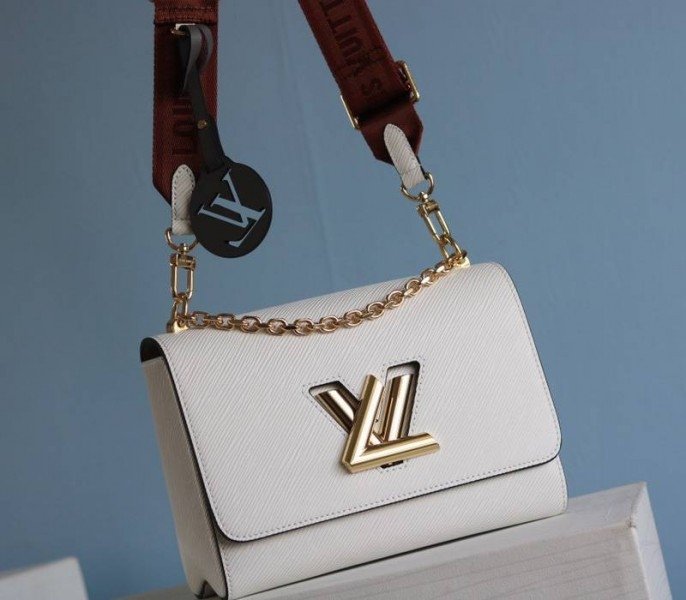 B2B48CCF-D280-1E00-EA89-E5672669DB28.jpg Louis Vuitton Epi Leather Twist MM Bag In Optic White With Jacquard Strap - Image 1