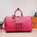 Louis Vuitton Taiga Leather Keepall Bandouliere 50 Travel Bag In Pink