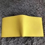 Yellow knockoff Hermes Copernic compact wallet