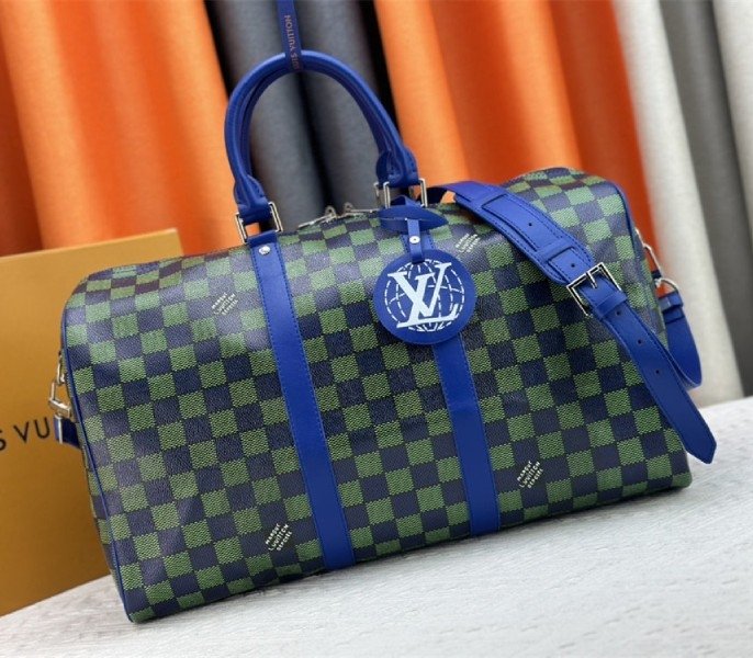CB8521BA-52C5-4A51-A134-EC5E2F0A2751.jpg Louis Vuitton Damier Heritage Canvas Keepall Bandouliere 45 In Blue Green - Image 1