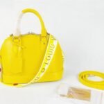 Louis Vuitton Epi Leather Alma BB Handbag In Cedrat Yellow With Jacquard Strap