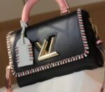 Louis Vuitton Epi Leather Twist MM Bag In Black With Braided Edges Flap - Image 2