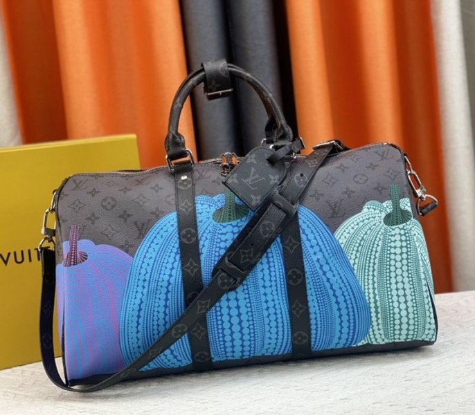 E3015403-5258-D379-94A0-79FBE1293D14.jpg Louis Vuitton X YK Monogram Eclipse Reverse Keepall 45 Luggage In Pumpkin - Image 1