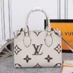 Louis Vuitton Bicolor Monogram Empreinte Leather Onthego PM Bag In Cream And Bois De Rose Pink